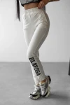 Spodnie damskie OLAVOGA SUGAR 2025 ecru - maWer Fashion