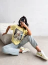T-shirt damski OLAVOGA EARNED 2026 żółty - maWer Fashion