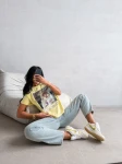 T-shirt damski OLAVOGA EARNED 2026 żółty - maWer Fashion