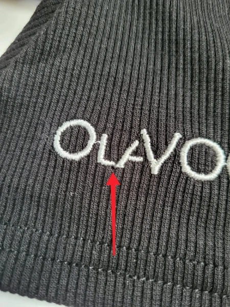 OUTLET Bluzka damska OLAVOGA LAMELLA czarna - produkt ze skazą